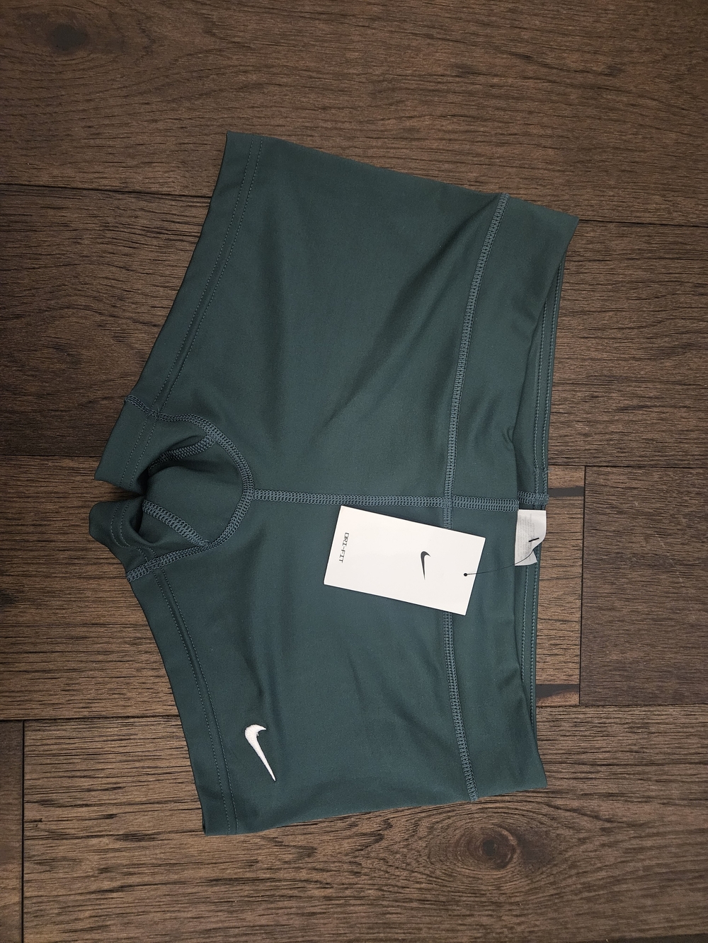 Nike Women’s Green Athletic Shorts with White Swoosh